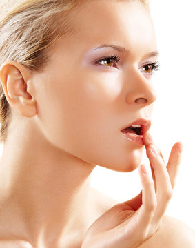 Health & skin care. Lovely woman touching her lips